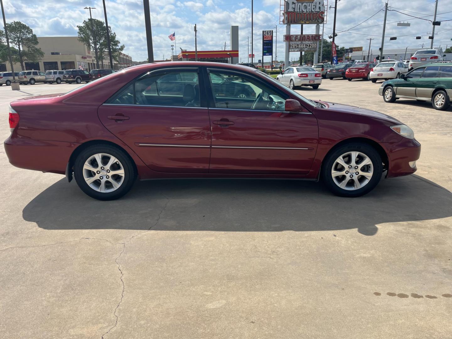 2006 red /TAN Toyota Camry LE V6 (4T1BF30KX6U) with an 3.0L V6 DOHC 24V engine, 5-Speed Automatic Overdrive transmission, located at 14700 Tomball Parkway 249, Houston, TX, 77086, (281) 444-2200, 29.928619, -95.504074 - Photo#7